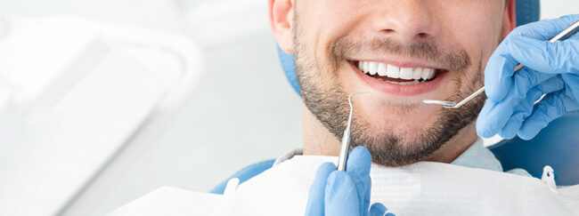 Young,Man,At,The,Dentist.,Dental,Care,,Taking,Care,Of best dentist in el paso