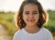 Happy child smiling at Divine Dental Spa: Affordable dental implants in El Paso, TX