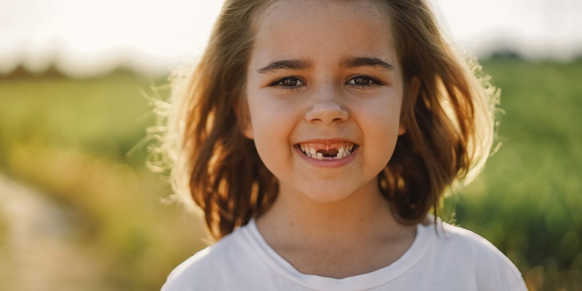 Happy child smiling at Divine Dental Spa: Affordable dental implants in El Paso, TX